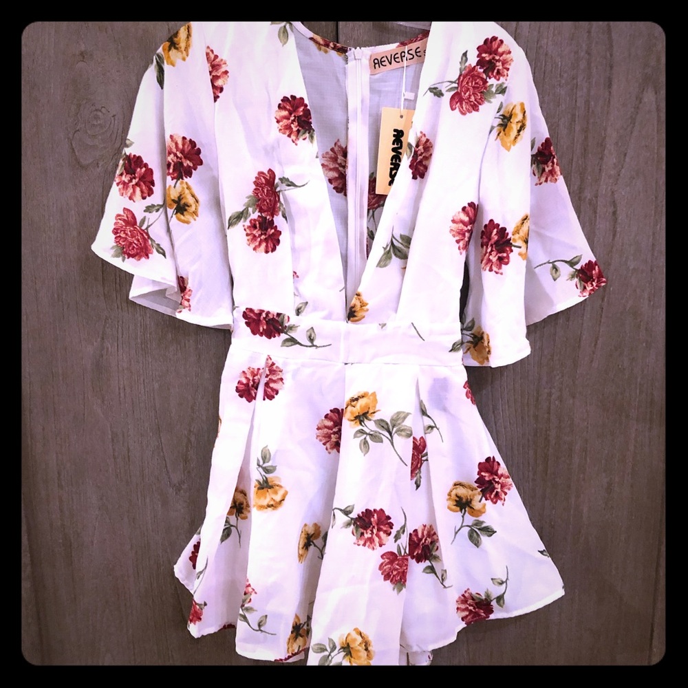 Reverse floral romper *with tags*